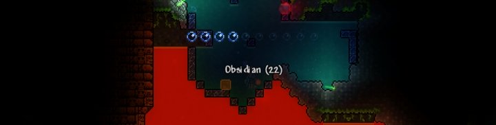 Mining Obsidian in Terraria, which is required to make Hellstone Bars for crafting gear